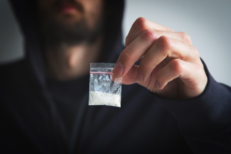 Cocaine addict with a bag cocaine